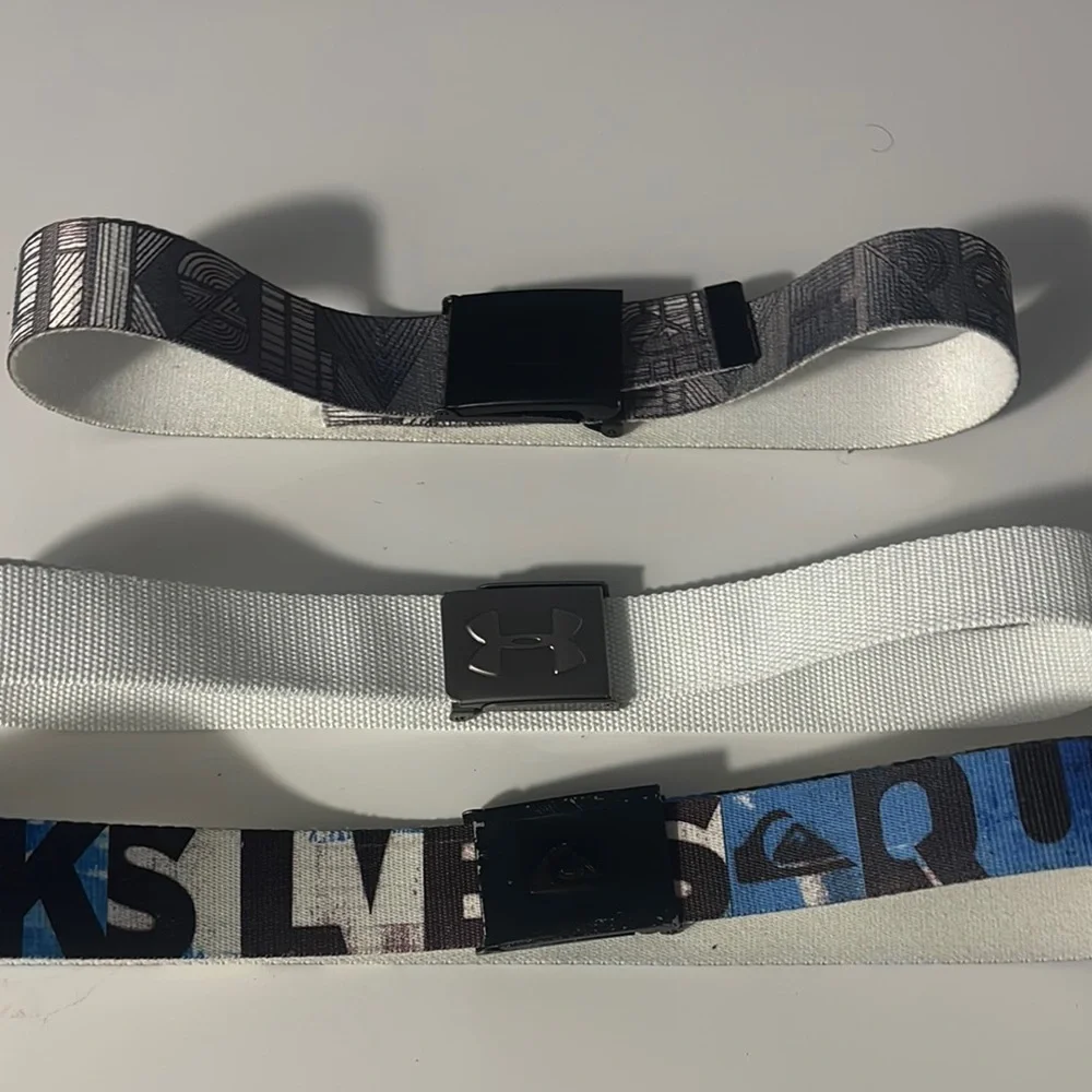 1 Under Armour Kids' Black and White Belt and 2 Quicksilver Belt! Set of 3